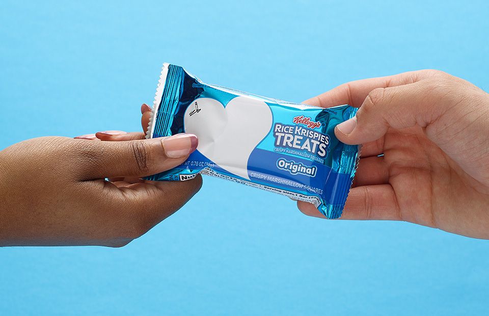two hands holding a Rice Krispies Treats® on each end of the packaging